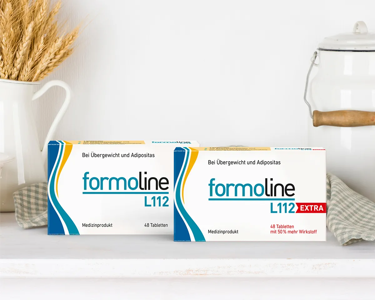 formoline L112 und L112 EXTRA Zwei formoline Produktverpackungen nebeneinander auf heller Fläche.